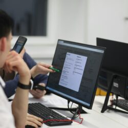 https://unsplash.com/photos/a-group-of-people-sitting-at-a-table-with-computers--JUlfa5fAIg?utm_content=creditShareLink&utm_medium=referral&utm_source=unsplash
